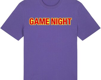 May include: Purple t-shirt with the text "GAME NIGHT" in red and yellow letters.