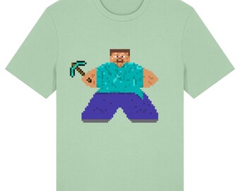 May include: A light green t-shirt featuring a pixelated character holding a pickaxe. The character has a brown head, a turquoise shirt, and blue pants. The text "Misty Jade" is in the bottom right corner.