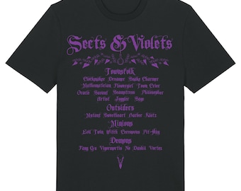 May include: Black t-shirt with the text "Sects & Violets" in purple gothic lettering. Below the title are lists of words such as "Townsfolk", "Outsiders", "Minions", and "Demons". The word "Black" is at the bottom right.