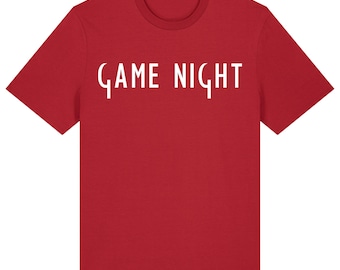 May include: A red t-shirt with the words "GAME NIGHT" printed in white, centered on the front. The shirt has short sleeves and a crew neck. The text is in a stylized font.