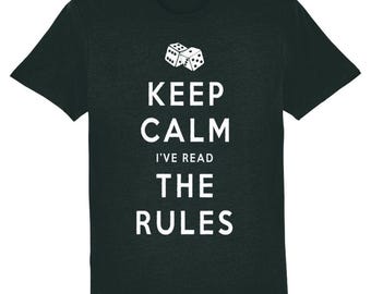 May include: A dark green t-shirt with white text that reads "Keep Calm I've Read The Rules" and a graphic of two dice.