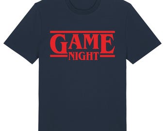 May include: A navy blue t-shirt with a red graphic that says "GAME NIGHT" in a stylized font.