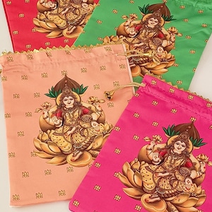 May include: Four colorful drawstring bags in red, green, peach, and pink. Each bag features a gold-toned illustration of a deity seated on a lotus flower. The bags have gold trim and drawstrings.