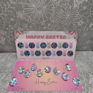 May include: Two pink cards with "Happy Easter" text and holographic egg designs. The top card has bunny graphics and saves $75. The bottom card has hanging egg designs and saves $50.