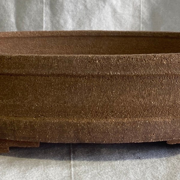 Oval bonsai pot in red sandstone. Oval bonsai pot in red will.