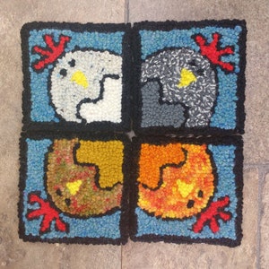 May include: Four square needlepoint panels with a blue background and a white, gray, brown, and orange rooster design. Each panel features a different color rooster with a red comb and wattle.