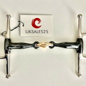 May include: Black and silver horse bit with a rose gold link. The bit has a D-ring on each end and a center link. The bit is labeled "UKSALES25".