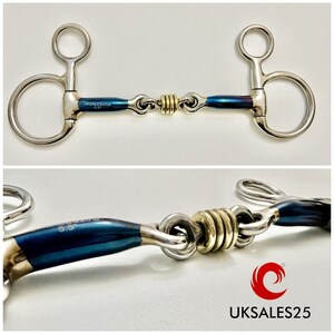 May include: A blue and silver horse bit with a gold roller. The bit is 5.5 inches long and has a D-ring on each end. The bit is marked "UKSALES25".