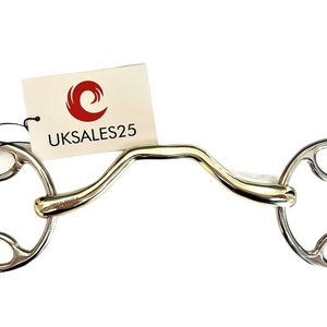 May include: A silver horse bit with a curved mouthpiece and two loose rings. The bit is designed to help with controlling a horse's mouth.