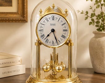 Reloj de sobremesa Remington de aniversario antiguo fabricado en Alemania / Reloj de sobremesa con cúpula de cristal y latón, de cuarzo múltiple / Péndulo de bola giratoria