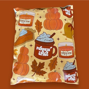 May include: A beige poly mailer bag with a repeating pattern of fall-themed illustrations. The design includes pumpkins, pumpkin spice mugs, candles, and fall leaves. The words "Pumpkin Spice" are printed on the mugs.