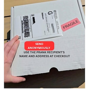 May include: A white cardboard box with a shipping label and a red "FRAGILE" sticker. A red rectangle with the words "SEND ANONYMOUSLY" is visible, along with the text "USE THE PRANK RECIPIENT'S NAME AND ADDRESS AT CHECKOUT."