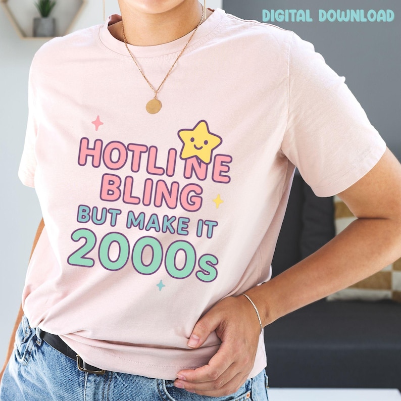 May include: A light pink t-shirt with the text "HOTLINE BLING BUT MAKE IT 2000s" in pink, blue, and green. A yellow star graphic is above the word "LINE". The words "DIGITAL DOWNLOAD" are in the top right corner.
