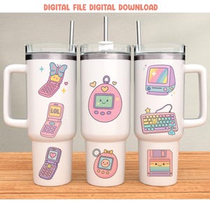 May include: White insulated tumblers with retro-themed designs. One features a pink flip phone with a butterfly, another has a pink Tamagotchi, and the third has a computer and keyboard. Each tumbler has a handle and a silver straw. Text at the top reads "DIGITAL FILE DIGITAL DOWNLOAD."