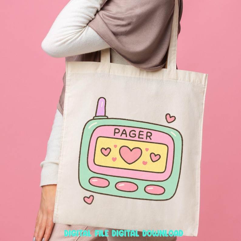 May include: Cream-colored tote bag featuring a cartoon pager design. The pager is outlined in mint green with a yellow screen displaying hearts and the word "PAGER". Pink hearts and a pink antenna complete the design. The words "DIGITAL FILE DIGITAL DOWNLOAD" are at the bottom.