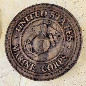 This is a Marine Corps style logo plaque.