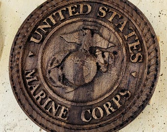This is a Marine Corps style logo plaque.