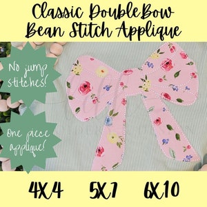 May include: A pink double bow applique with a floral pattern. The applique is designed for machine embroidery and is available in three sizes: 4x4, 5x7, and 6x10 inches. The text "No jump stitches!" and "One piece applique!" is included in the image.