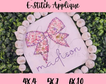 Enkel broderidesign med applikation och rosett med E-stitch-mönster
