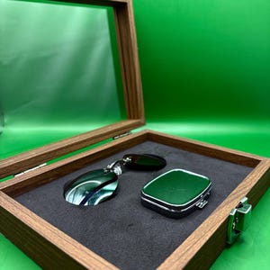May include: A handmade, wooden serving tray with a natural finish. The tray features a rectangular shape with rounded corners and raised edges. It is ideal for serving food or displaying decorative items. The tray measures approximately 12 inches long, 8 inches wide, and 2 inches high.
