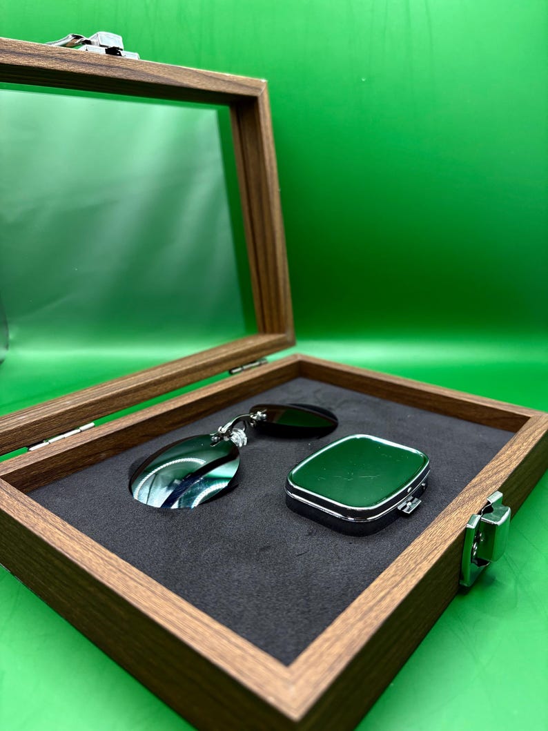 May include: A handmade, wooden serving tray with a natural finish. The tray features a rectangular shape with rounded corners and raised edges. It is ideal for serving food or displaying decorative items. The tray measures approximately 12 inches long, 8 inches wide, and 2 inches high.