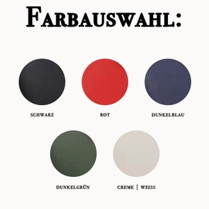 May include: Five colour swatches for fabric or paint. The colours are black, red, dark blue, dark green, and cream or white.