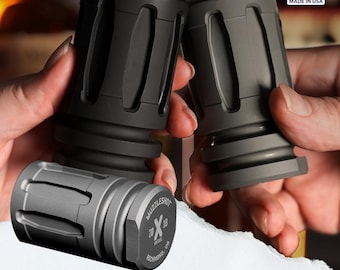 May include: Two black metal muzzle brakes with a silver muzzle brake with the text "Muzzleshot 20 x 18" and "Richmond, VA" on the side. Made in the USA.