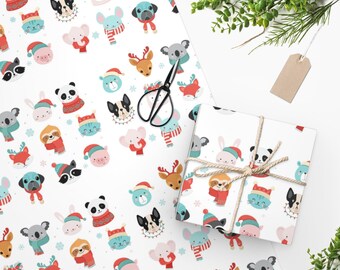 May include: White wrapping paper with a repeating pattern of cute animal faces wearing winter hats and scarves. The animals include a koala, panda, deer, sloth, cat, dog, rabbit, and raccoon. The paper is decorated with snowflakes and a red and white candy cane.