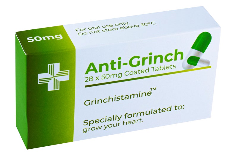 May include: A green and white box of Anti-Grinch tablets, with a green cross on the side. The box says "28 x 50mg Coated Tablets" and "Grinchistamine&trade;". The text also says "Specially formulated to: grow your heart."
