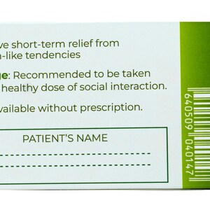 May include: A white box with green trim and a barcode. The text on the box reads "Effective short-term relief from Grinch-like tendencies. Dosage: Recommended to be taken with a healthy dose of social interaction. Now available without prescription. PATIENT'S NAME"