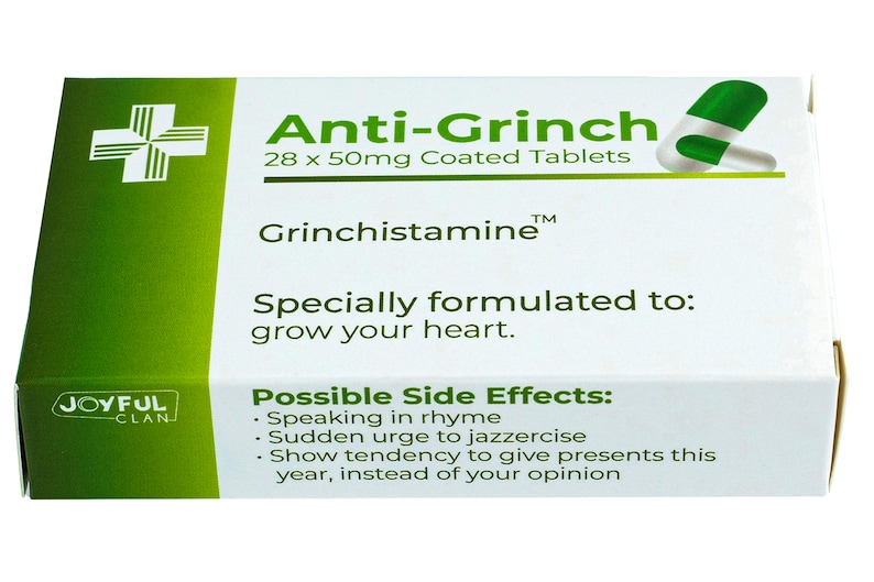 May include: A green and white box of Anti-Grinch tablets, with the text "28 x 50mg Coated Tablets" and "Grinchistamine&trade;". The box also says "Specially formulated to: grow your heart." and lists possible side effects, including "Speaking in rhyme" and "Sudden urge to jazzercise".