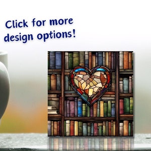 May include: A stained glass heart design on a bookshelf filled with colorful books. The heart is made up of many small pieces of glass in shades of red, orange, yellow, blue, and green.