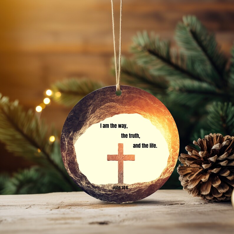 May include: Round, brown, and gold Christmas bauble with a white background featuring a cross and the text "I am the way, the truth, and the life. John 14:6".