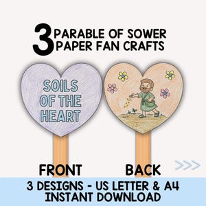 May include: Two heart-shaped paper fan crafts on wooden sticks. The left heart is purple with the text SOILS OF THE HEART. The right heart is peach-coloured with a cartoon illustration of a person sowing seeds, surrounded by small colourful flowers.