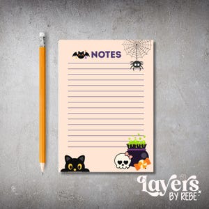 May include: A Halloween-themed notepad with the word "NOTES" at the top. The notepad features illustrations of a bat, spider, spiderweb, black cat, skull, and cauldron. A yellow pencil is placed next to the notepad.