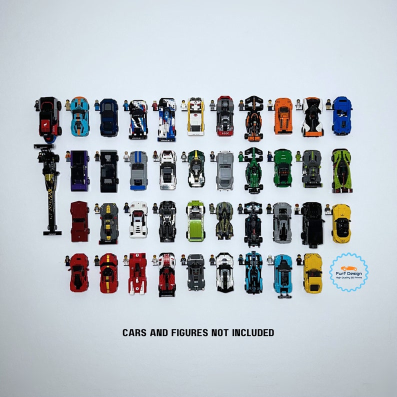 Shows 41 of the current 43 available speed champions cars being displayed with their individual minifigs next to them using the available wall mounts for sale. Cars are pointed up in the photo.