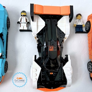 Shows the Solus GT car displayed with the minifig using the available wall mount.