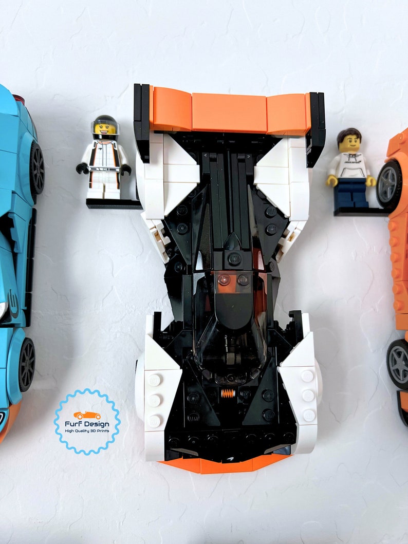 Shows the Solus GT car displayed with the minifig using the available wall mount.