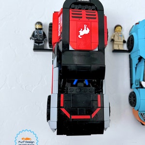 Shows the ford bronco car displayed with the minifig using the available wall mount.