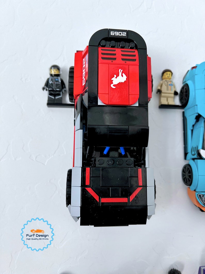 Shows the ford bronco car displayed with the minifig using the available wall mount.