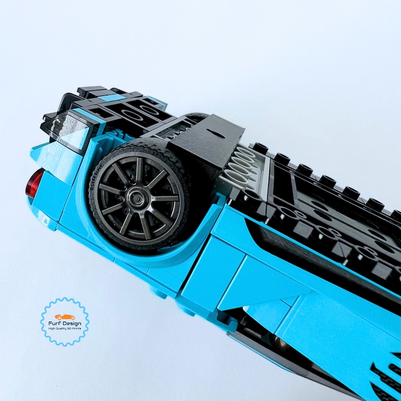 Shows the available wall mount fitting around the wheels of the car as it would be when the car is displayed.