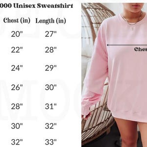 May include: Size chart for a unisex Gildan 18000 sweatshirt, showing chest and length measurements in inches for sizes S through 4XL. The chart is printed on a white background.