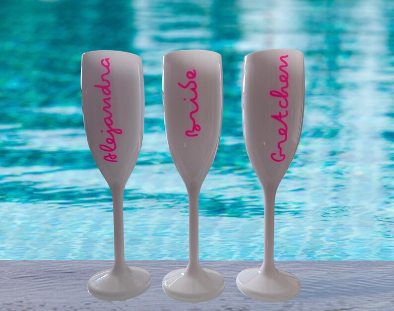 Personalized acrylic champagne flutes with custom Love Island inspired names and colorful vinyl decals. Lightweight reusable 5 oz flutes perfect for bachelorette parties, bridal showers, girls trips, birthdays, and party favors. Customized drinkware with tropical summer aesthetic.
