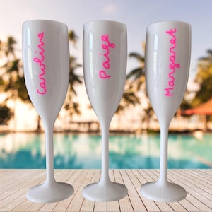 Personalized acrylic champagne flutes with custom Love Island inspired names and colorful vinyl decals. Lightweight reusable 5 oz flutes perfect for bachelorette parties, bridal showers, girls trips, birthdays, and party favors. Customized drinkware with tropical summer aesthetic.