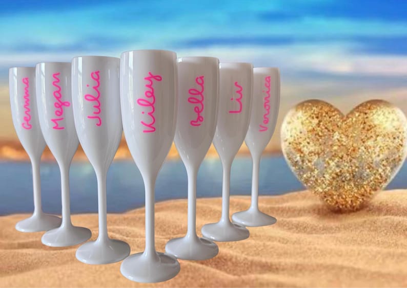 Personalized acrylic champagne flutes with custom Love Island inspired names and colorful vinyl decals. Lightweight reusable 5 oz flutes perfect for bachelorette parties, bridal showers, girls trips, birthdays, and party favors. Customized drinkware with tropical summer aesthetic.