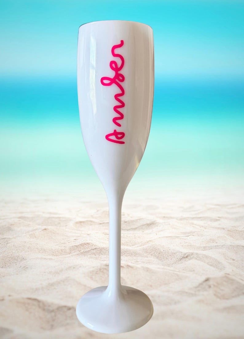 Personalized acrylic champagne flutes with custom Love Island inspired names and colorful vinyl decals. Lightweight reusable 5 oz flutes perfect for bachelorette parties, bridal showers, girls trips, birthdays, and party favors. Customized drinkware with tropical summer aesthetic.