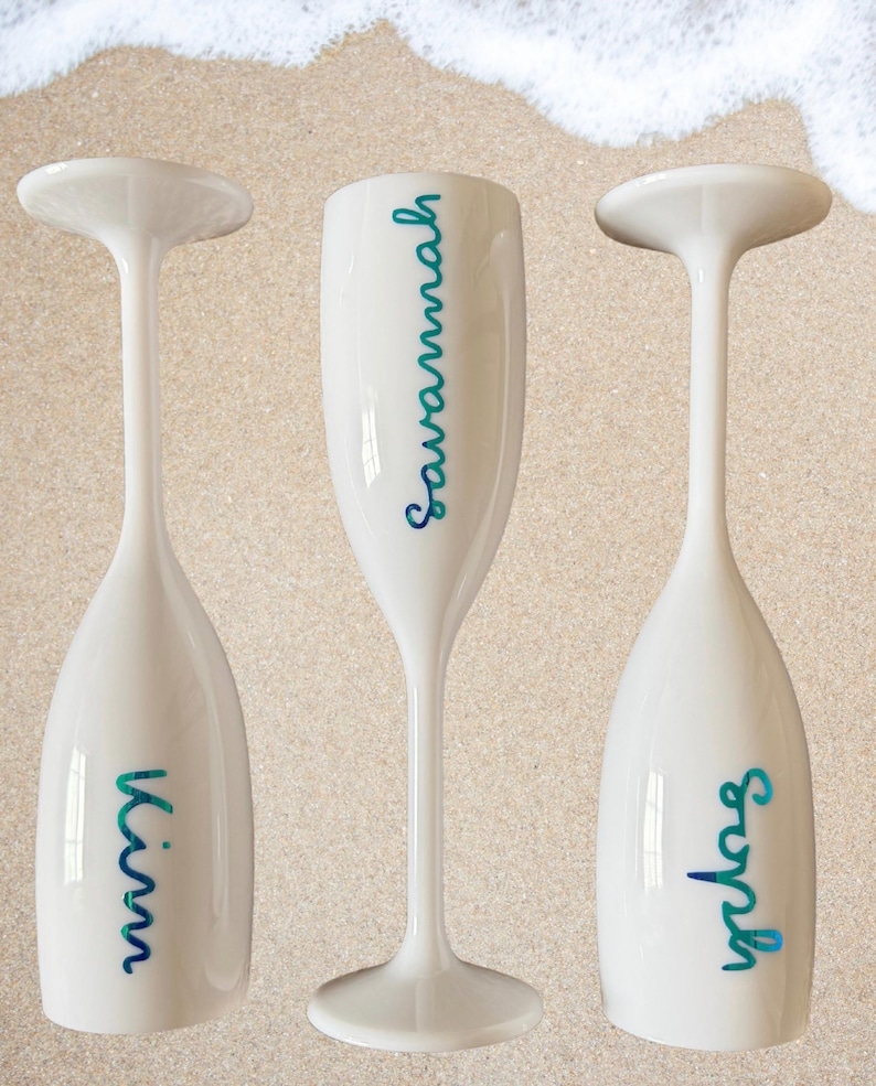 Personalized acrylic champagne flutes with custom Love Island inspired names and colorful vinyl decals. Lightweight reusable 5 oz flutes perfect for bachelorette parties, bridal showers, girls trips, birthdays, and party favors. Customized drinkware with tropical summer aesthetic.
