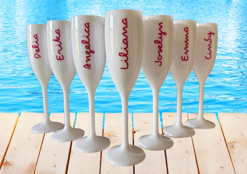Personalized acrylic champagne flutes with custom Love Island inspired names and colorful vinyl decals. Lightweight reusable 5 oz flutes perfect for bachelorette parties, bridal showers, girls trips, birthdays, and party favors. Customized drinkware with tropical summer aesthetic.