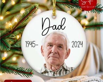 May include: White ceramic Christmas ornament with a photo of a man and the text "Dad 1945-2024".