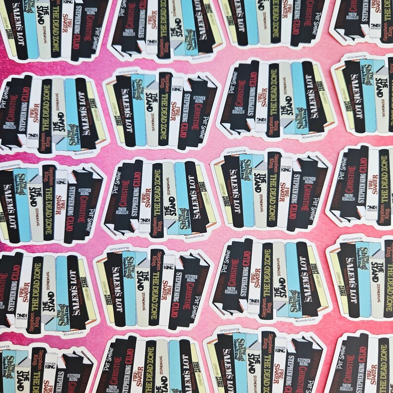 May include: A stack of colorful stickers featuring the titles of Stephen King novels, including "Salem's Lot", "The Stand", "Firestarter", "Christine", "The Dead Zone", and "Cujo".